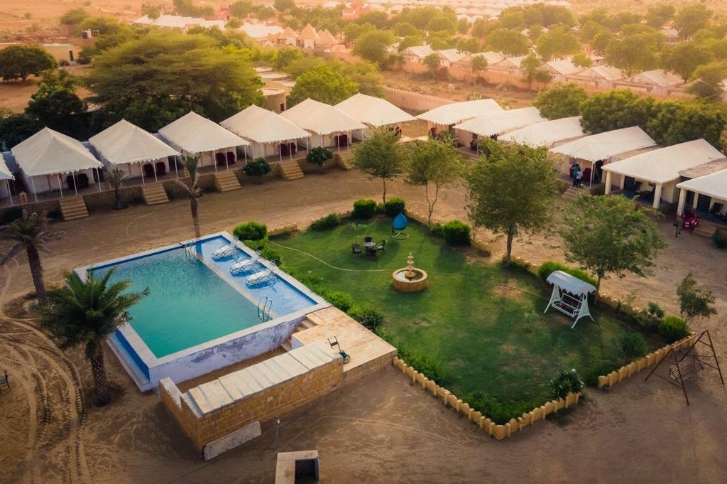 New Steps Holidays Jaisalmer Packages Resort with swimming in jaisalmer Jaislamer diwali packages Best jaisalmer resort best jaisalmer hotel budget hotel in jaisalmer Heritage Juma Resort with swimming pool in sam sand dunes desert jaisalmer